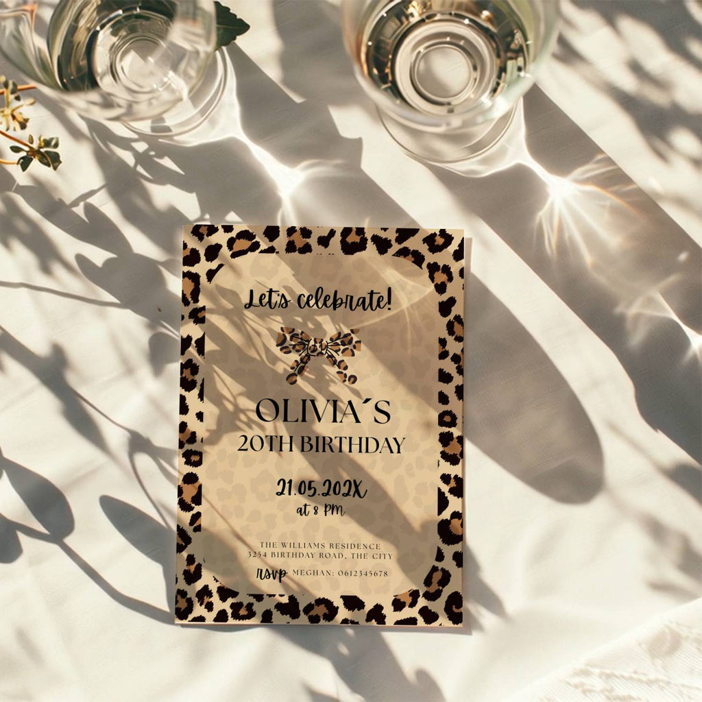 neutral beige cheetah print birthday invitation with leopard border and modern typography