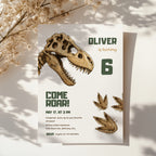 Editable dinosaur fossil birthday invitation featuring a realistic T-Rex skull and prehistoric footprints Canva template