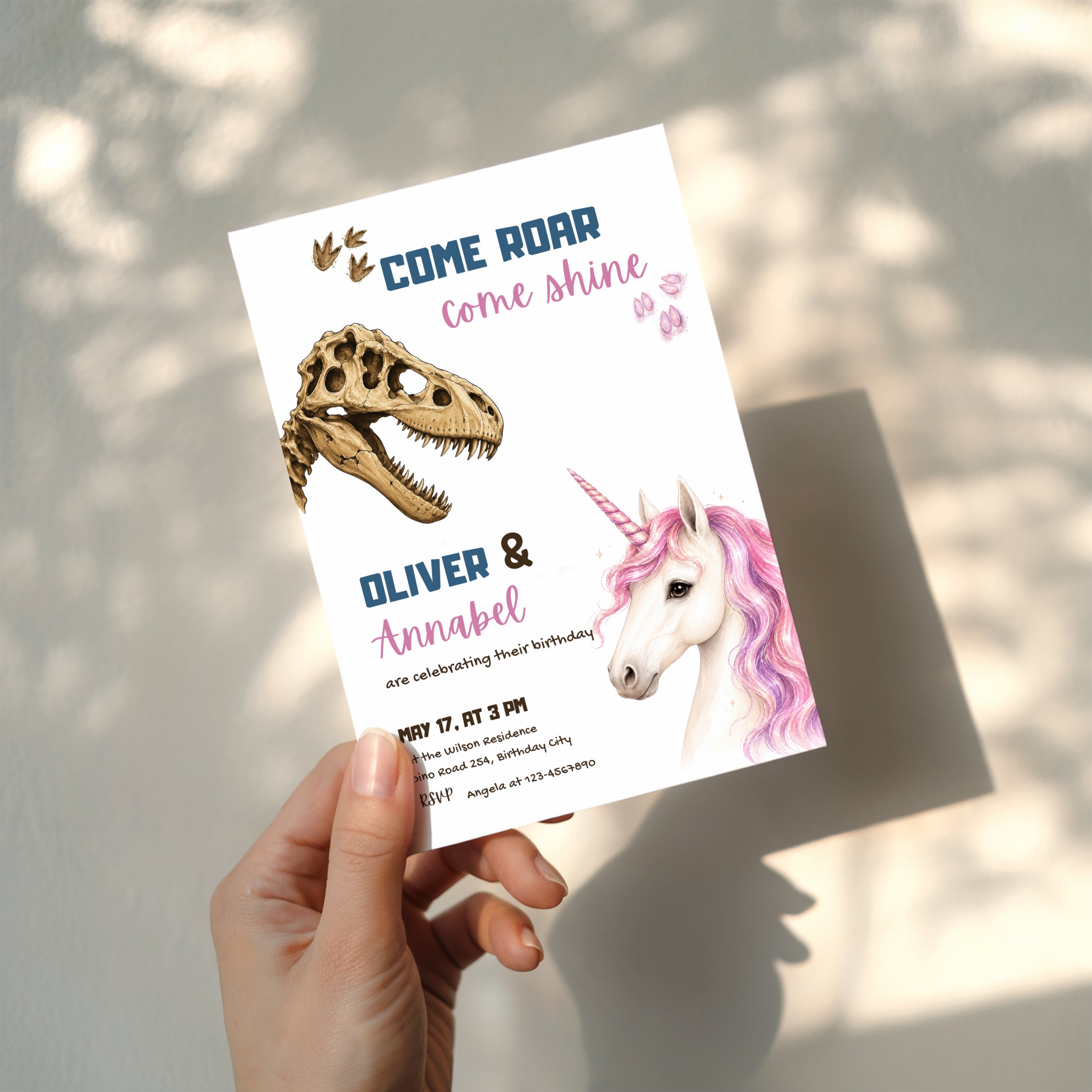 Editable dinosaur unicorn twin birthday invitation featuring a realistic dinosaur fossil and magical unicorn Canva template
