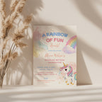 Editable pastel rainbow unicorn birthday invitation with watercolor unicorn and colorful rainbow Canva template
