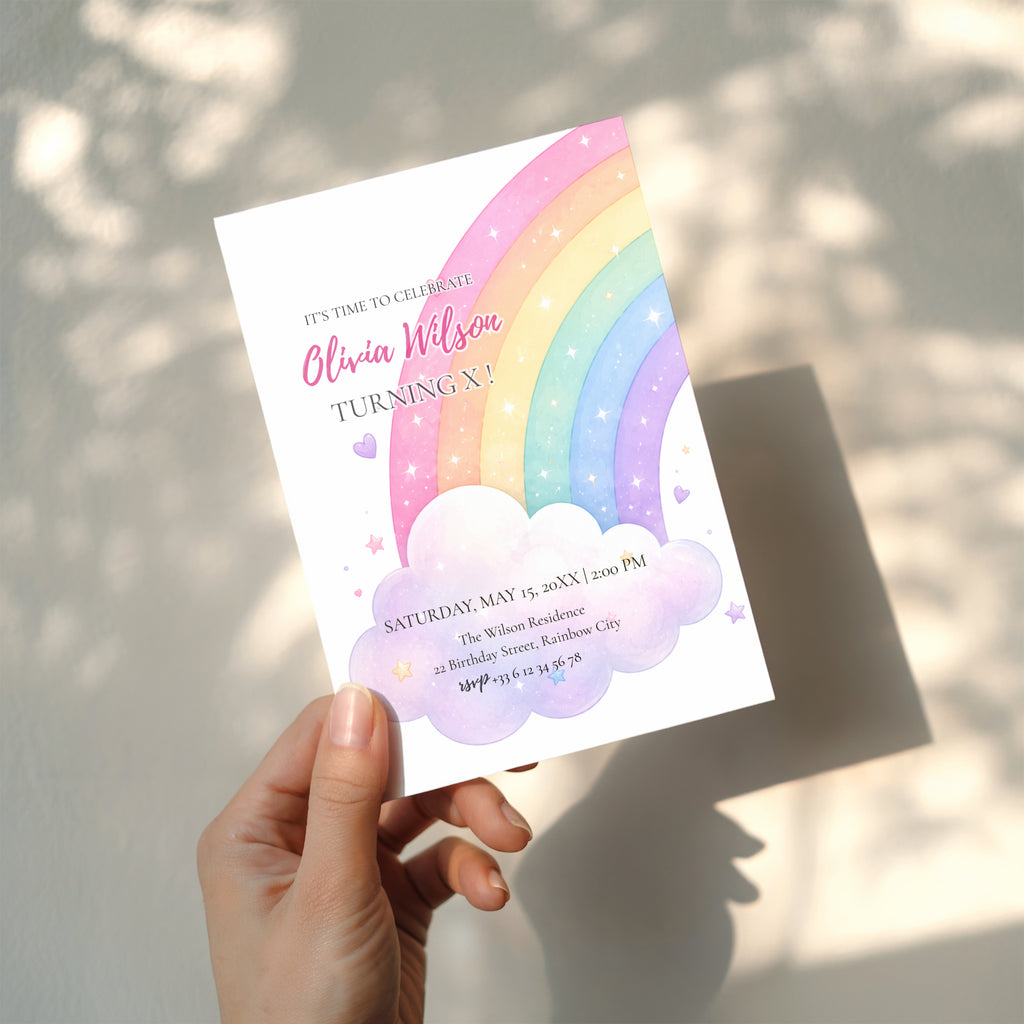 Editable pastel rainbow birthday invitation featuring a watercolor rainbow, fluffy clouds and soft pastel colors Canva template