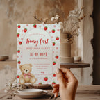 Editable Berry & Beary First birthday invitation with a teddy bear, strawberries, pink flowers, and an elegant arched design for a girl's first birthday party.