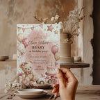 Sweet Beary First birthday invitation featuring a teddy bear, blush balloons, birthday cake, gifts, and pastel watercolor details for a girl's first birthday.
