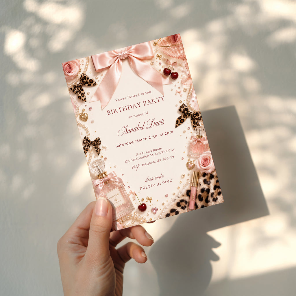 Coquette birthday party invitation featuring pink satin bows, pearls, perfume bottles, cherries, roses, and leopard print accents in an elegant blush aesthetic.