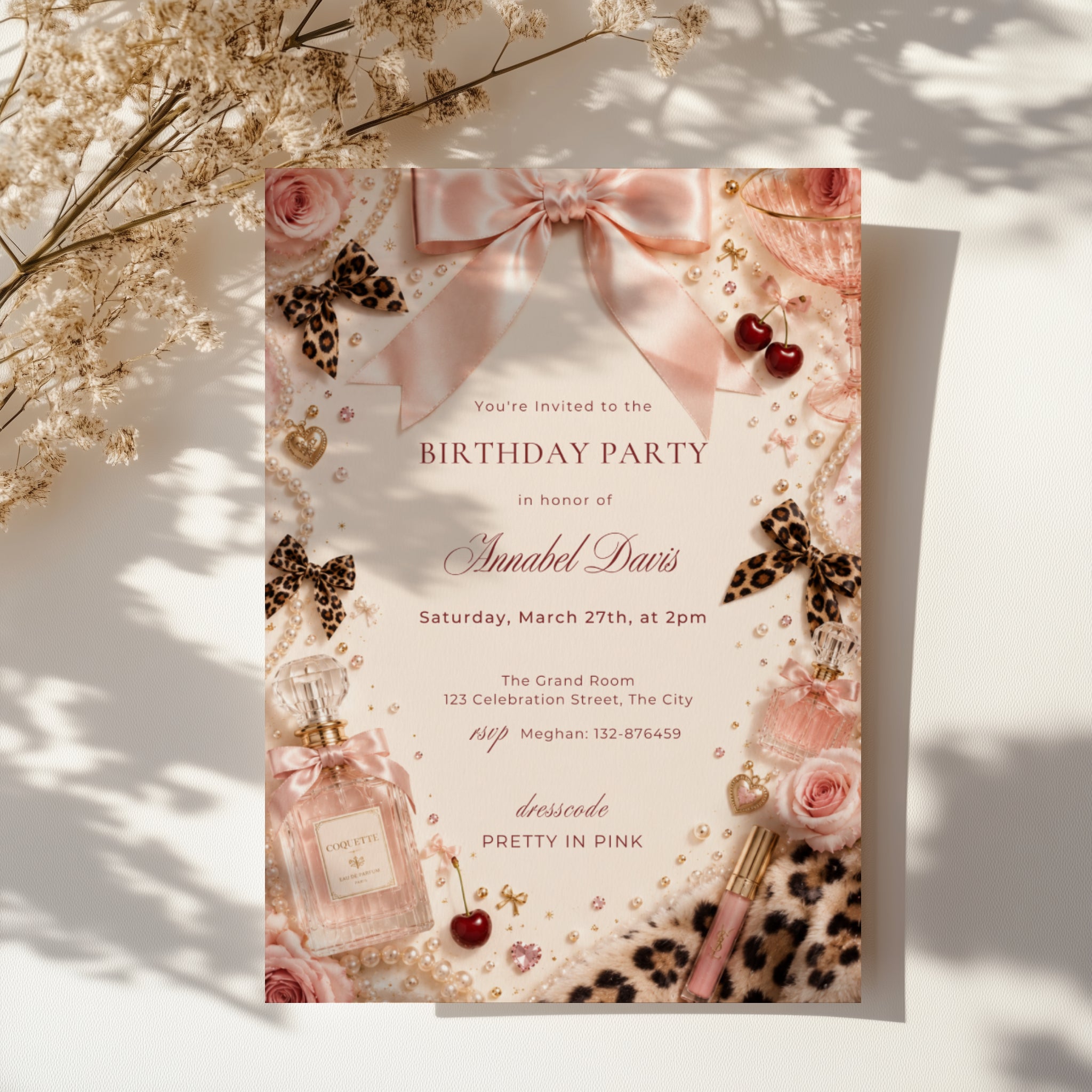 Coquette birthday party invitation featuring pink satin bows, pearls, perfume bottles, cherries, roses, and leopard print accents in an elegant blush aesthetic.