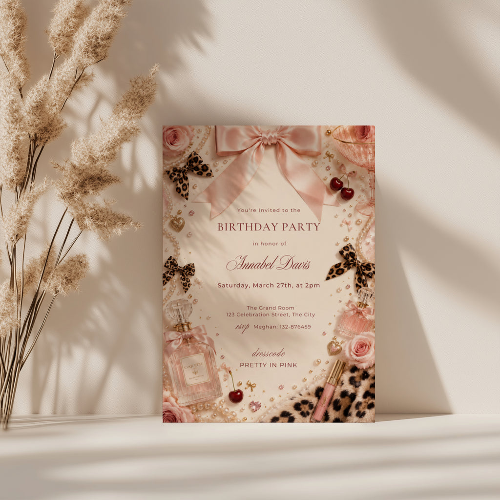 Coquette birthday party invitation featuring pink satin bows, pearls, perfume bottles, cherries, roses, and leopard print accents in an elegant blush aesthetic.