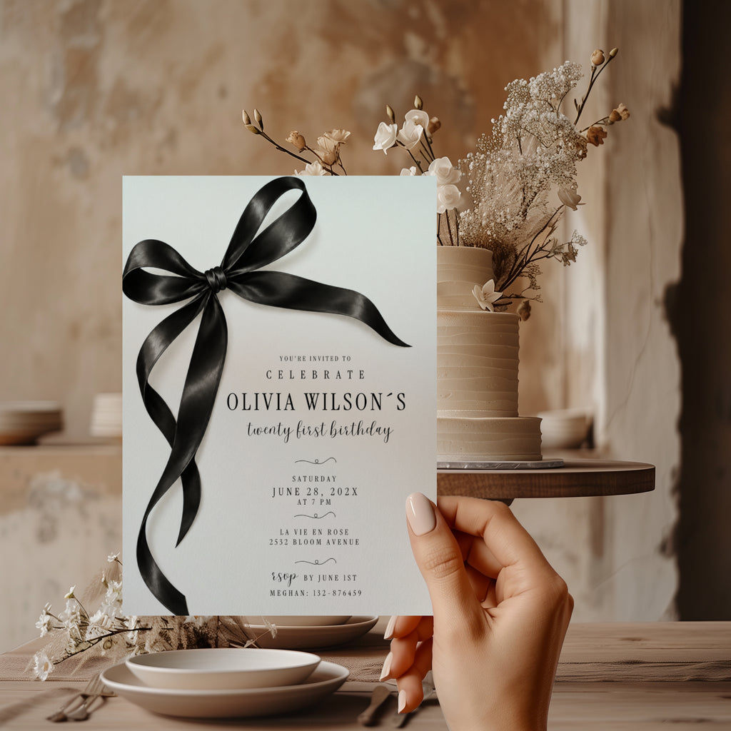 Black bow 21st birthday invitation with an oversized satin ribbon, minimalist black typography, and an elegant white layout for a milestone celebration.