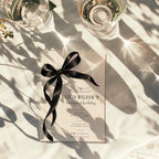 Black bow 21st birthday invitation with an oversized satin ribbon, minimalist black typography, and an elegant white layout for a milestone celebration.