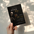 Boos and Booze Halloween party invitation featuring a skeleton holding a whiskey glass, black background, and amber typography for an adult Halloween party.