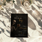 Boos and Booze Halloween party invitation featuring a skeleton holding a whiskey glass, black background, and amber typography for an adult Halloween party.