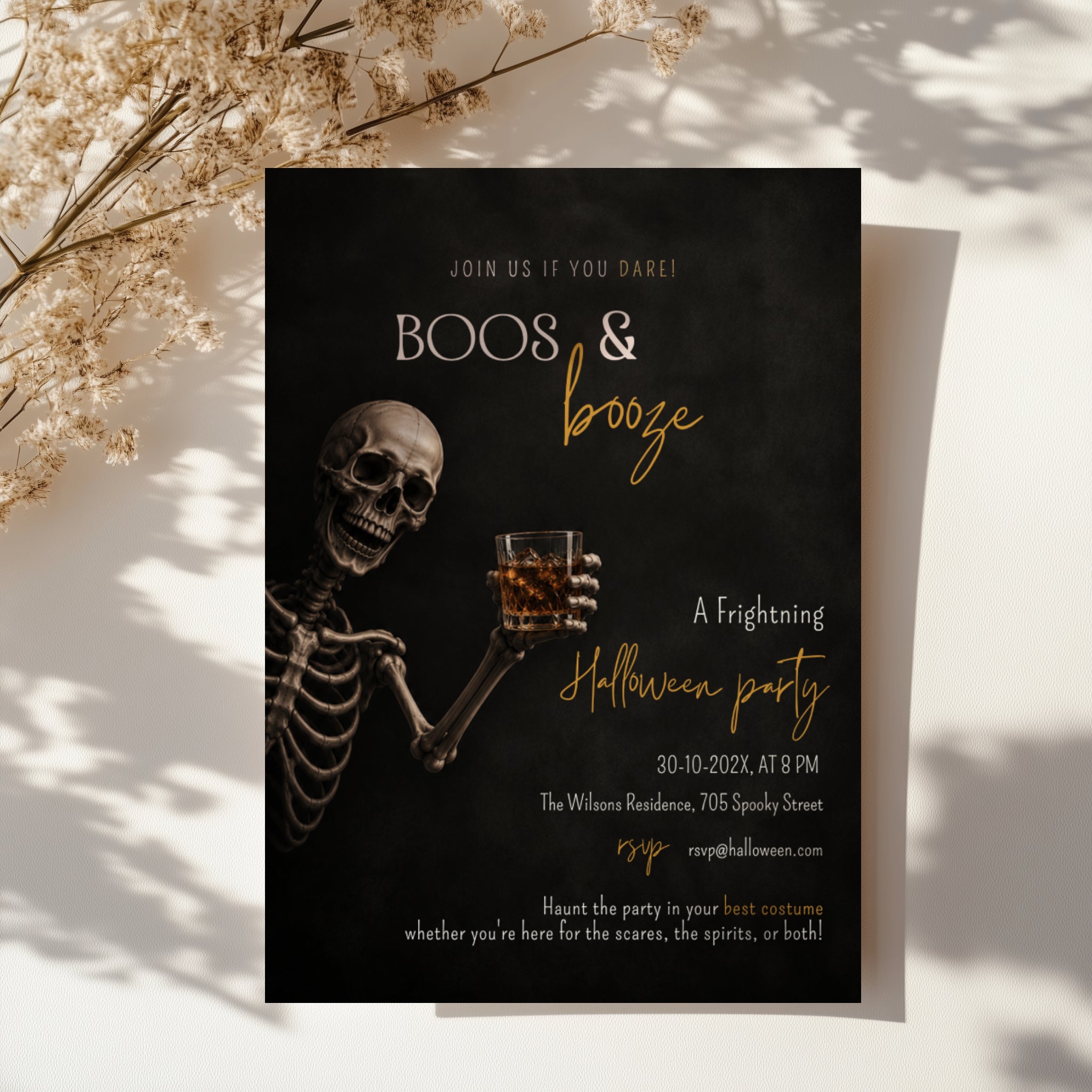 Boos and Booze Halloween party invitation featuring a skeleton holding a whiskey glass, black background, and amber typography for an adult Halloween party.