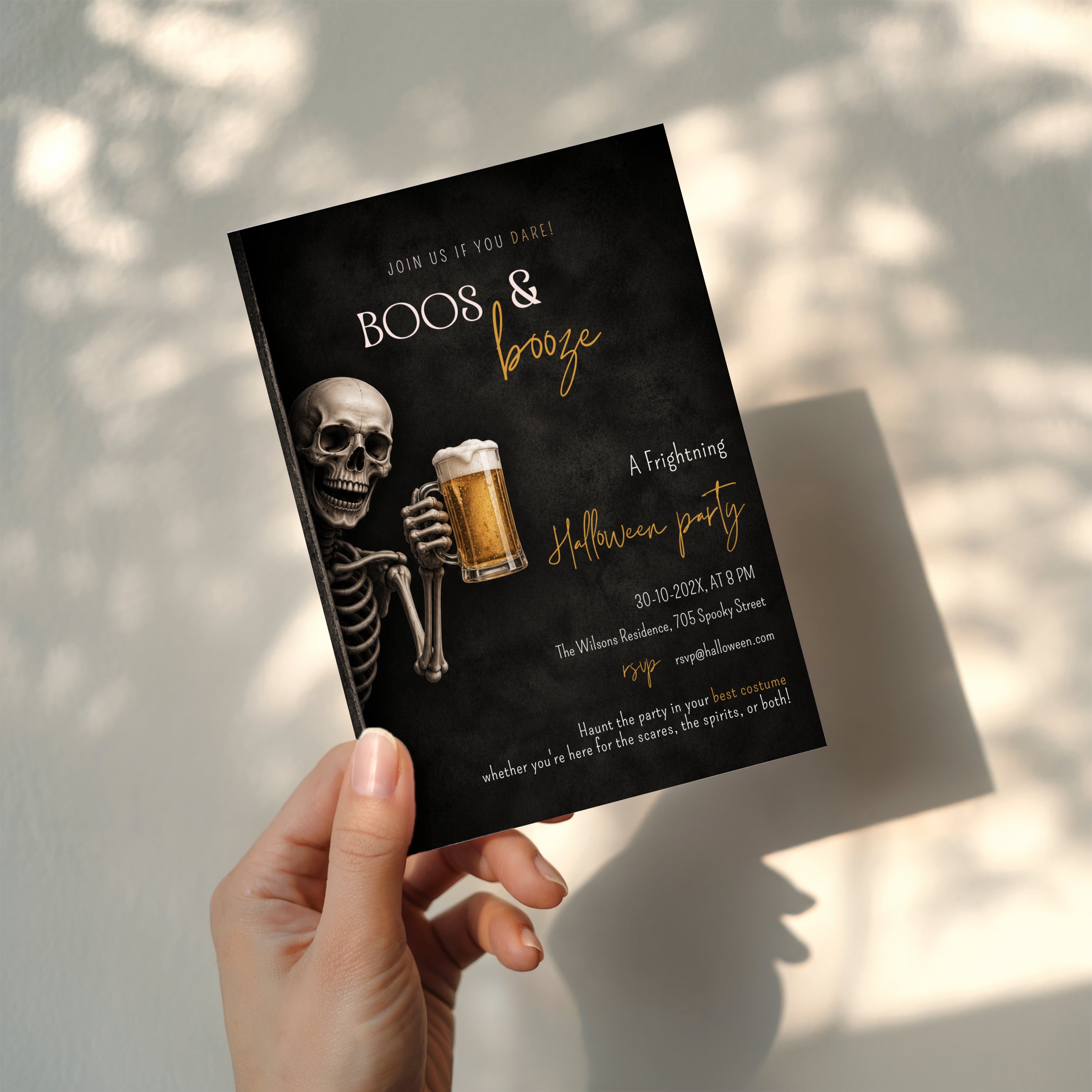 Skeleton beer Halloween party invitation with a grinning skeleton holding a frosty beer and a dark Boos & Booze party design with amber lettering.