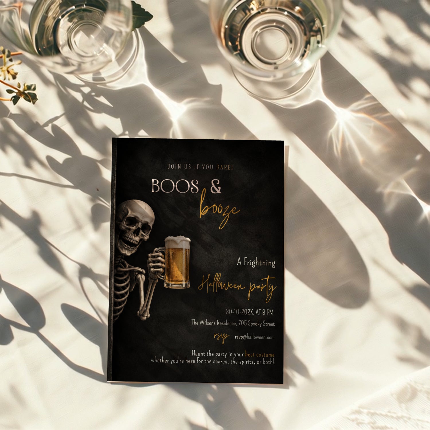 Skeleton beer Halloween party invitation with a grinning skeleton holding a frosty beer and a dark Boos & Booze party design with amber lettering.