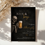 Skeleton beer Halloween party invitation with a grinning skeleton holding a frosty beer and a dark Boos & Booze party design with amber lettering.