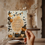 Watercolor Halloween birthday party invitation with a cute ghost, orange pumpkins, witch hats, bats, balloons, and a bubbling black cauldron.
