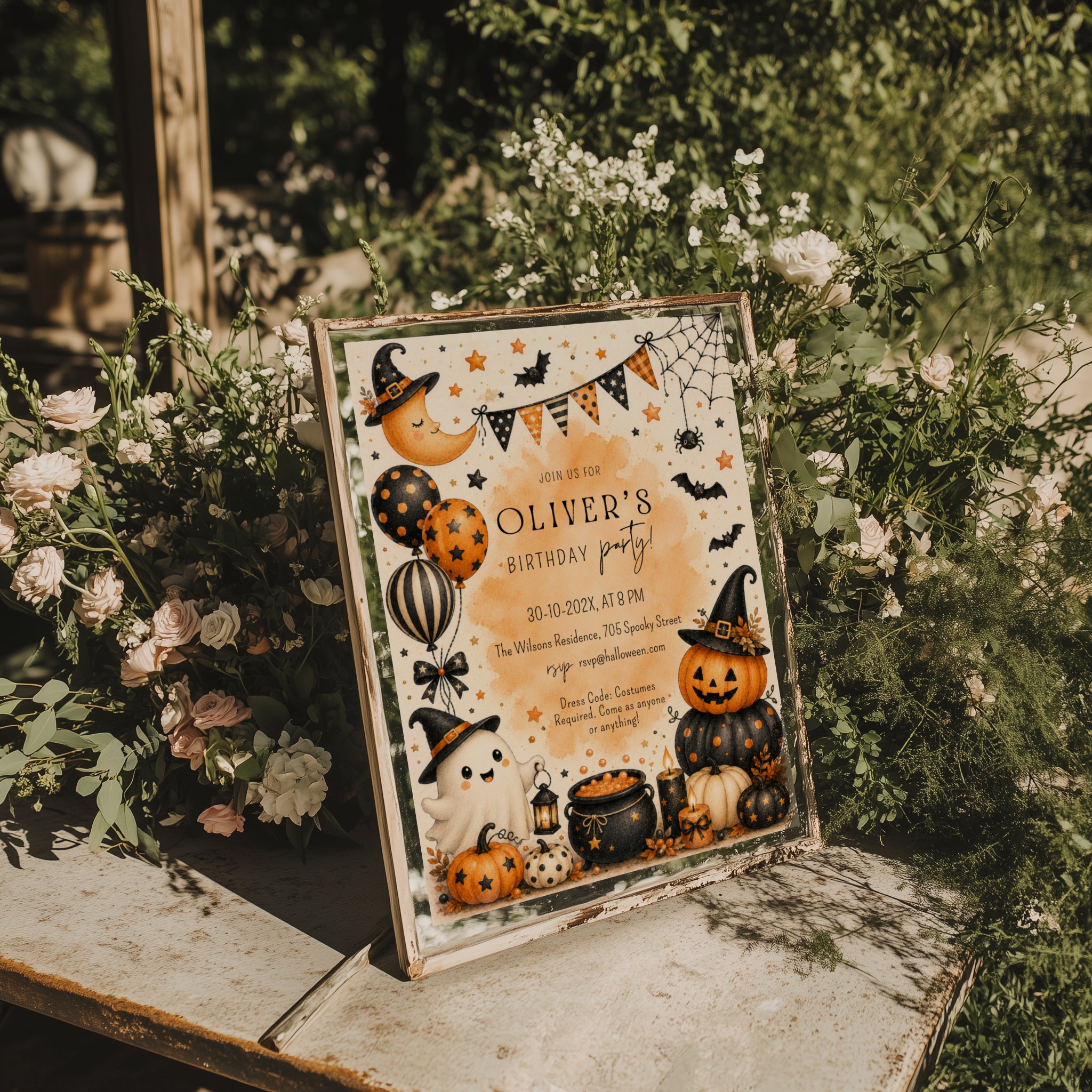 Watercolor Halloween birthday party invitation with a cute ghost, orange pumpkins, witch hats, bats, balloons, and a bubbling black cauldron.