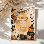 Watercolor Halloween birthday party invitation with a cute ghost, orange pumpkins, witch hats, bats, balloons, and a bubbling black cauldron.