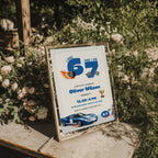 6 7 birthday invitation with bold blue 67 numbers, blue race car, checkered flags, flaming tire and trophy details for a racing 7th birthday party.