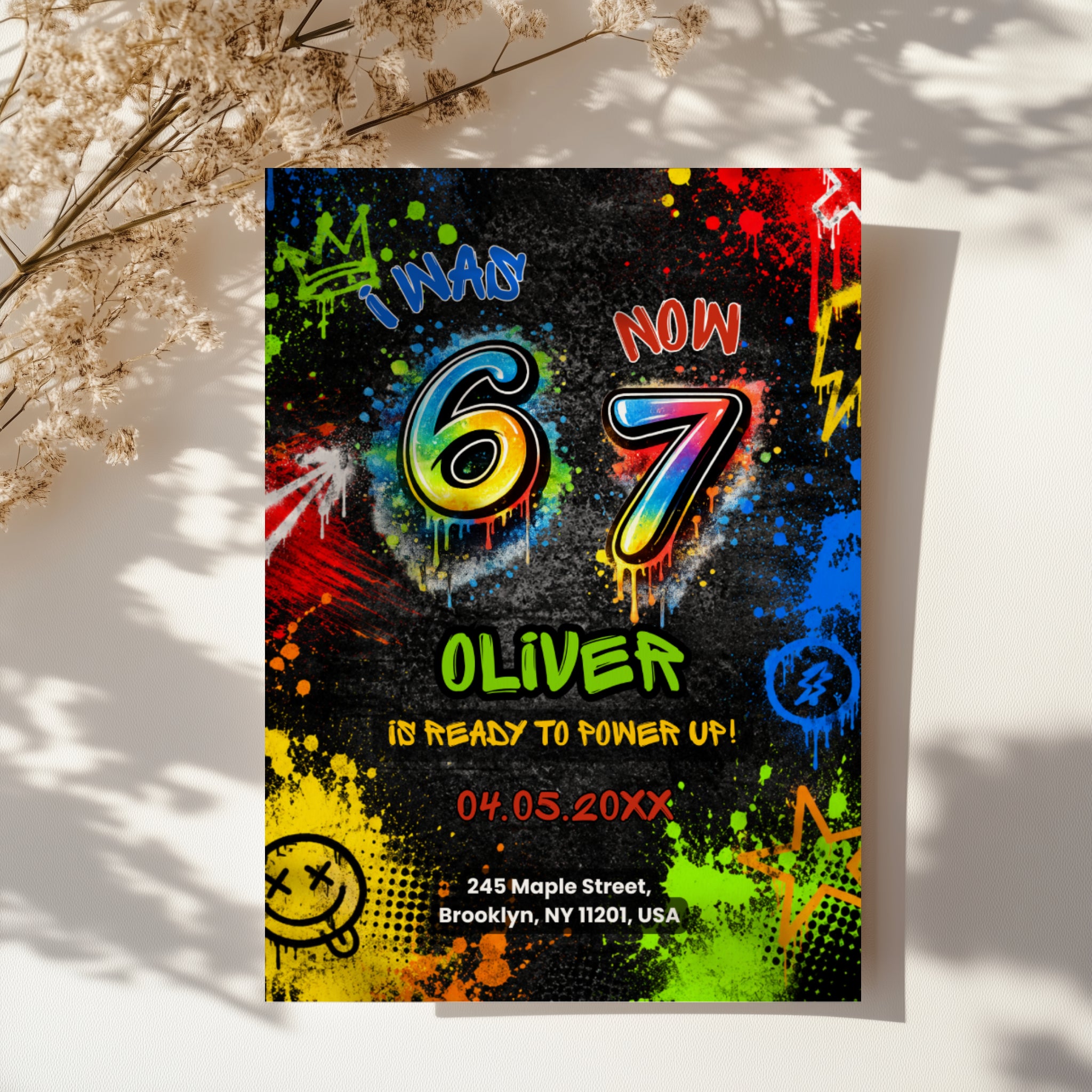 6 7 birthday invitation with colorful 67 numbers, bright graffiti paint splashes, neon colors, crown, stars and lightning details on a black background.
