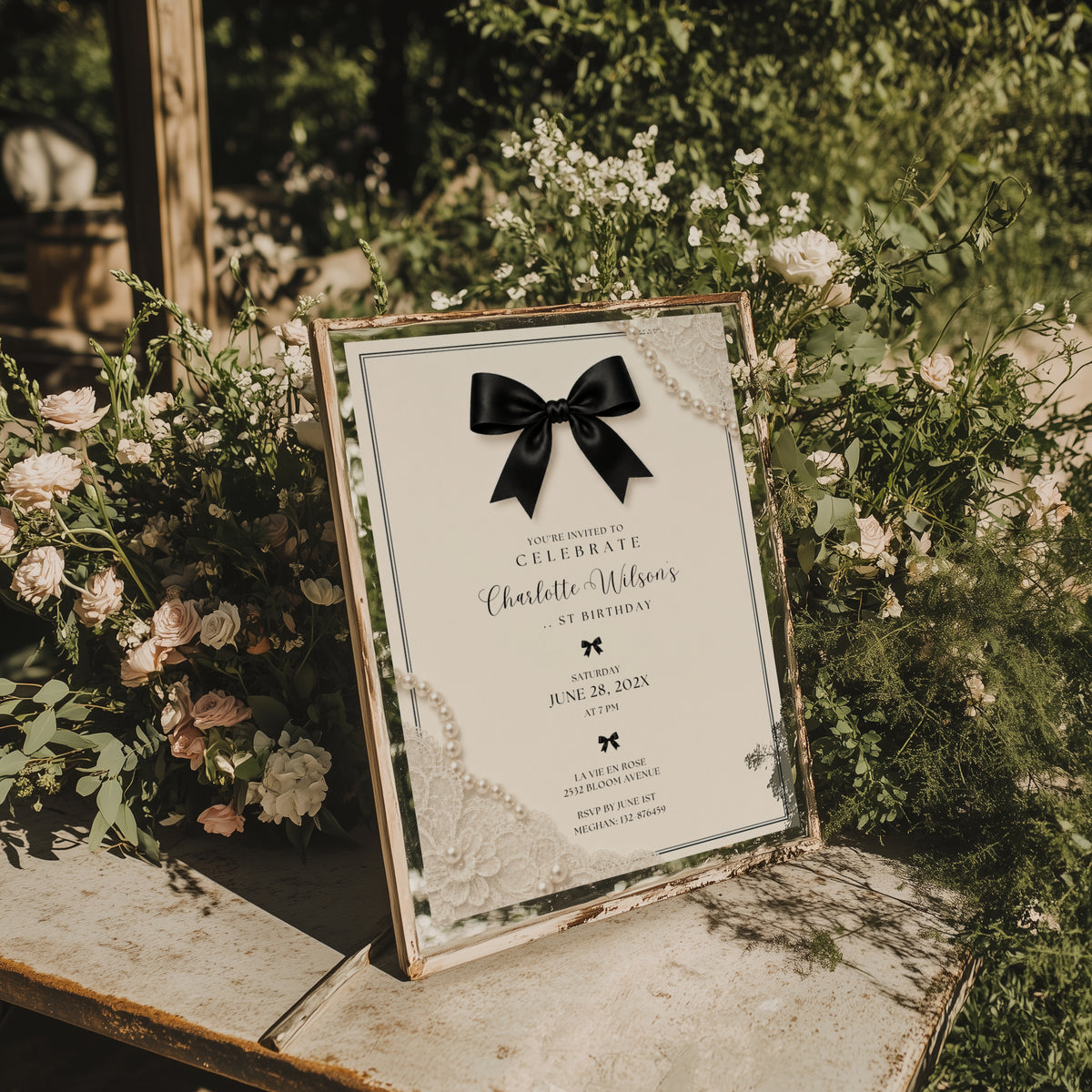 Elegant black bow birthday invitation with ivory background, pearl details and delicate vintage inspired lace accents.