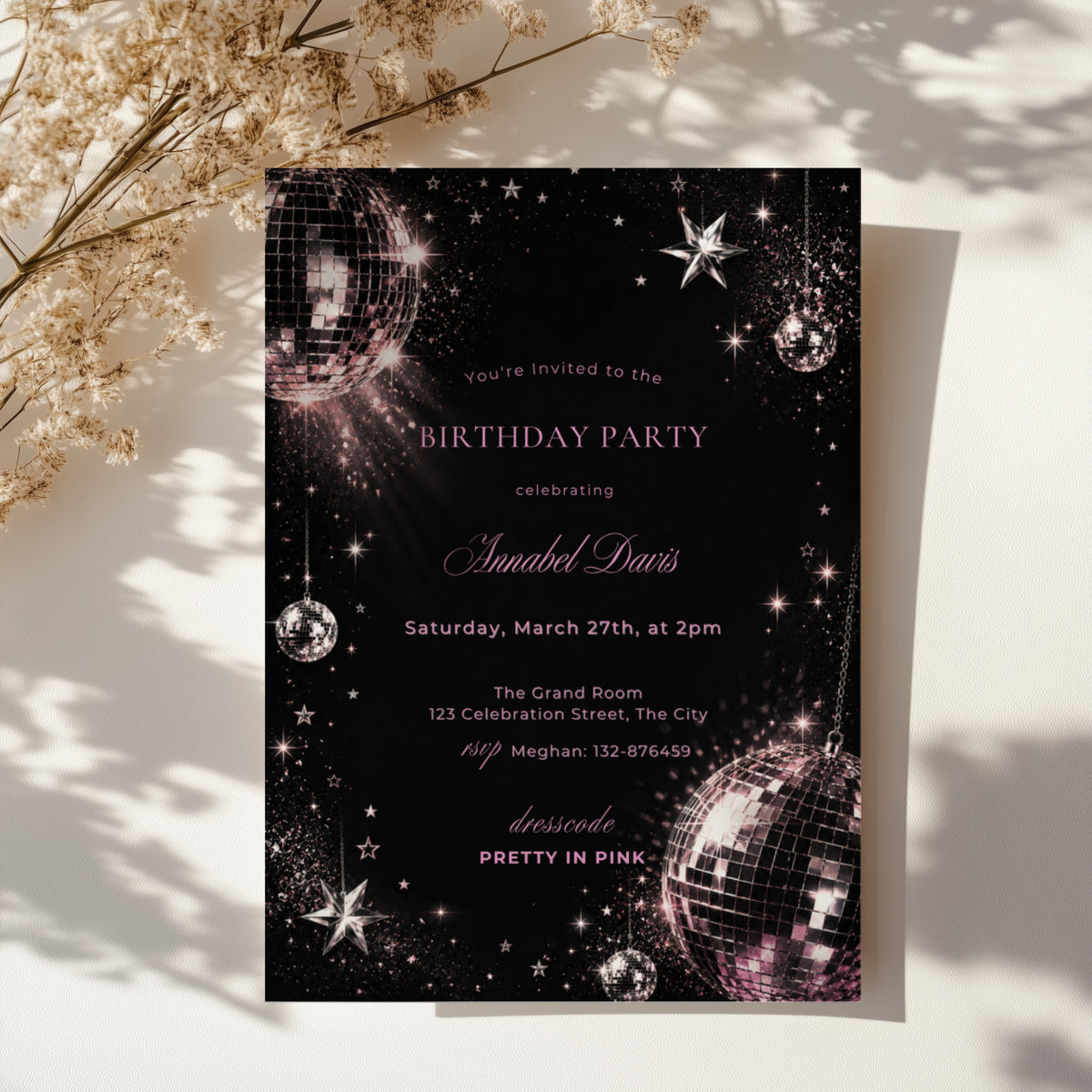 Black and pink disco birthday invitation with shimmering disco balls, sparkling stars and glamorous dark party details.