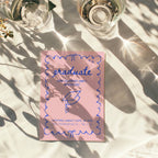 cute pink graduation invitation with blue hand drawn doodle border and playful typography