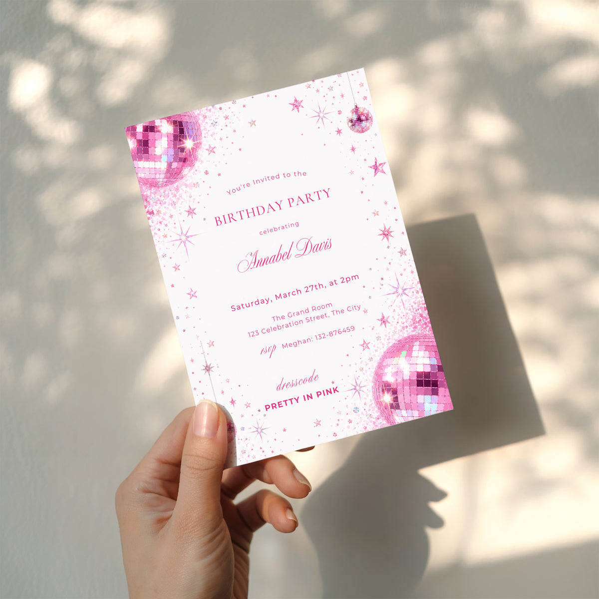 Pink disco birthday invitation with sparkling pink disco balls, glitter details, stars and Pretty in Pink dress code for a glamorous birthday party.