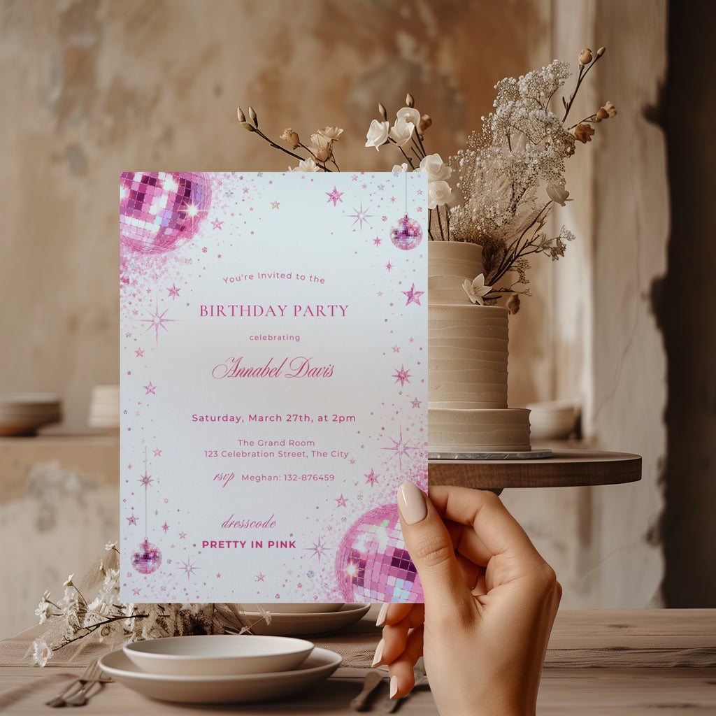 Pink disco birthday invitation with sparkling pink disco balls, glitter details, stars and Pretty in Pink dress code for a glamorous birthday party.