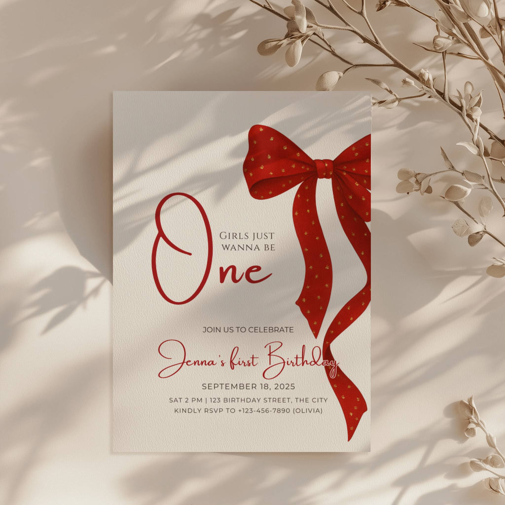 first birthday invitation with red bow and elegant gold accent design