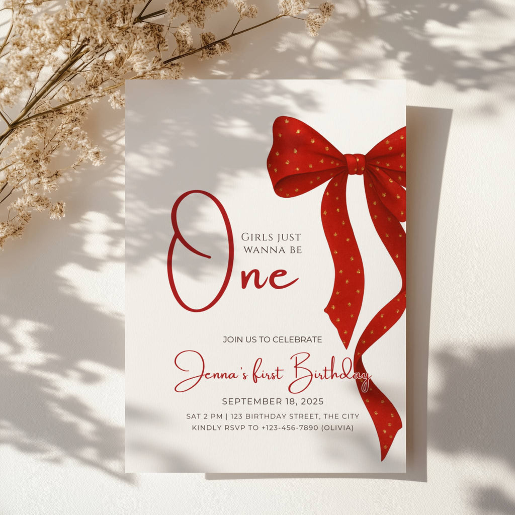 first birthday invitation with red bow and elegant gold accent design