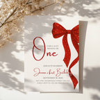 first birthday invitation with red bow and elegant gold accent design