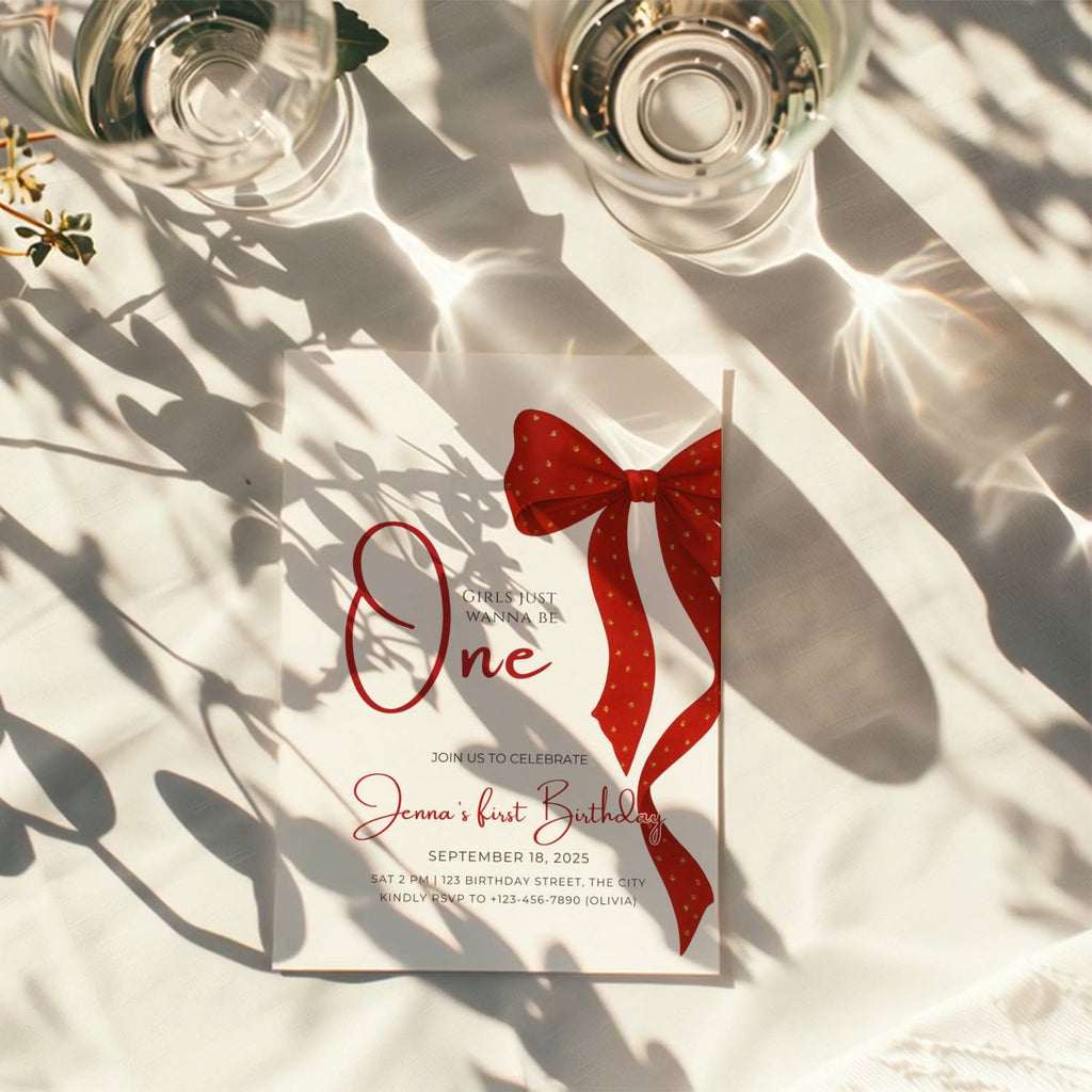 first birthday invitation with red bow and elegant gold accent design