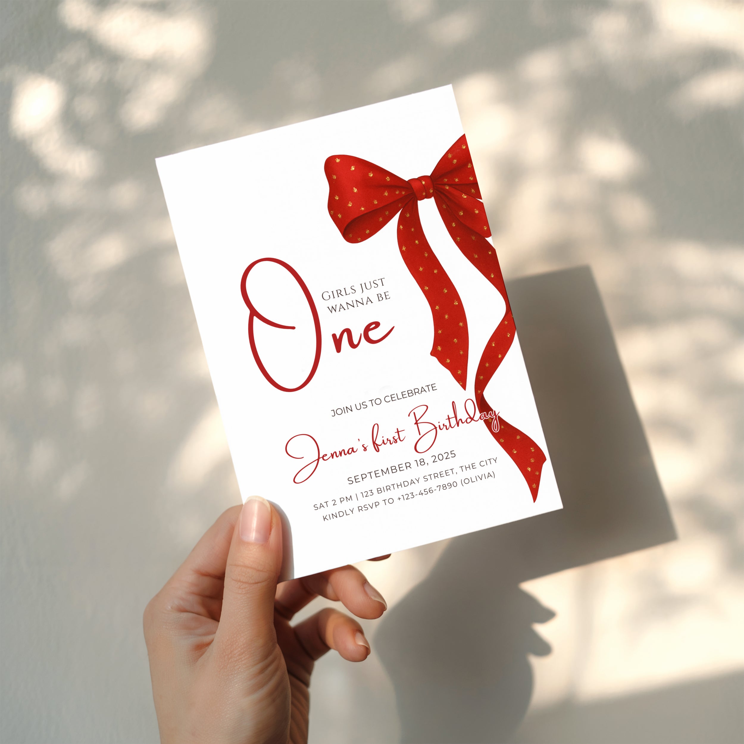 first birthday invitation with red bow and elegant gold accent design