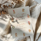 christmas baby shower invitation with cute gingerbread characters and festive red accents