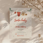 santa baby shower invitation with clothesline illustration and winter snowflake background