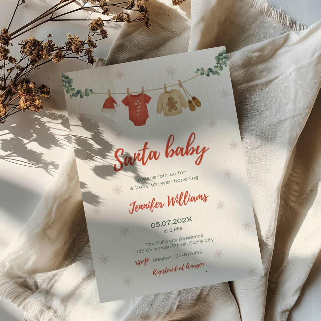 santa baby shower invitation with clothesline illustration and winter snowflake background