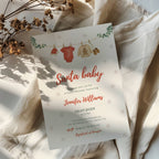 santa baby shower invitation with clothesline illustration and winter snowflake background