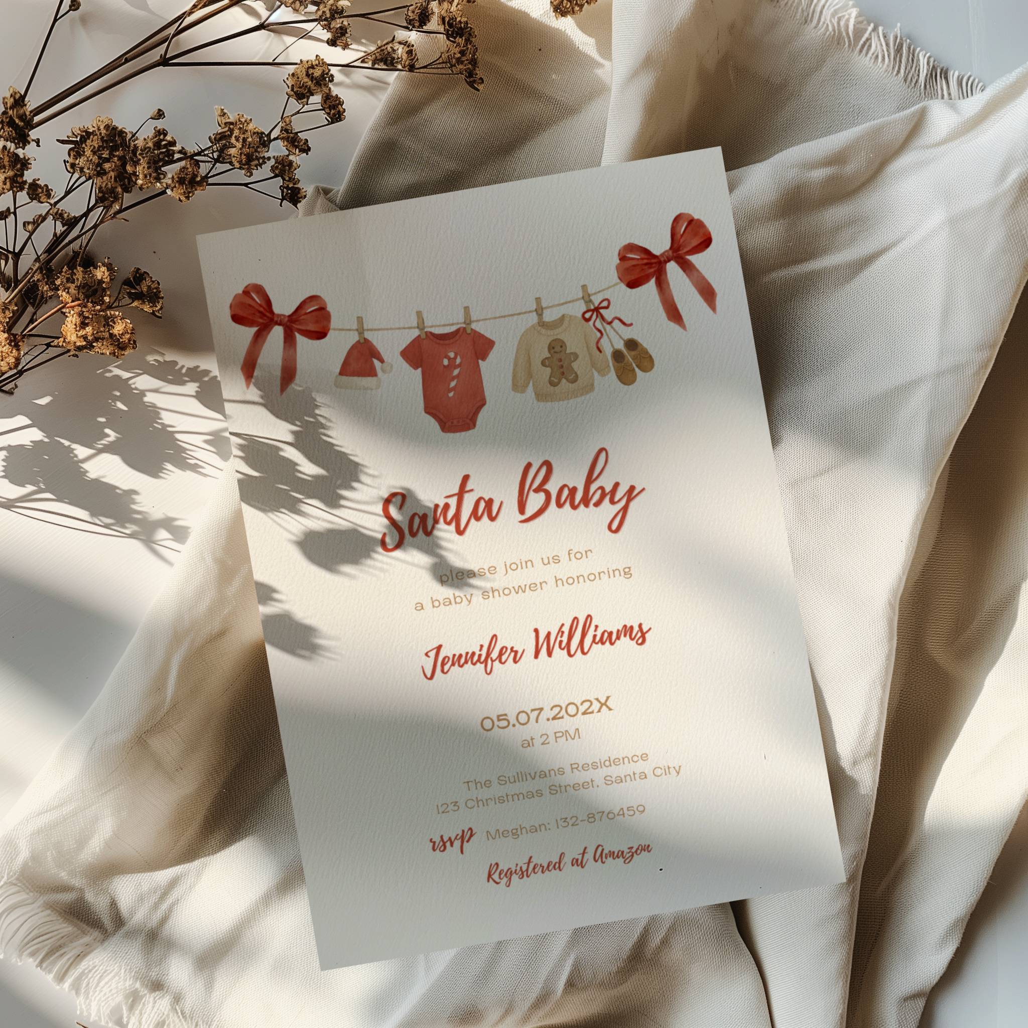 santa baby shower invitation with red bows and watercolor baby clothesline illustration