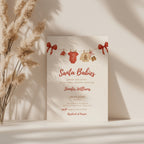 twin santa baby shower invitation with red bows and watercolor baby clothesline illustration