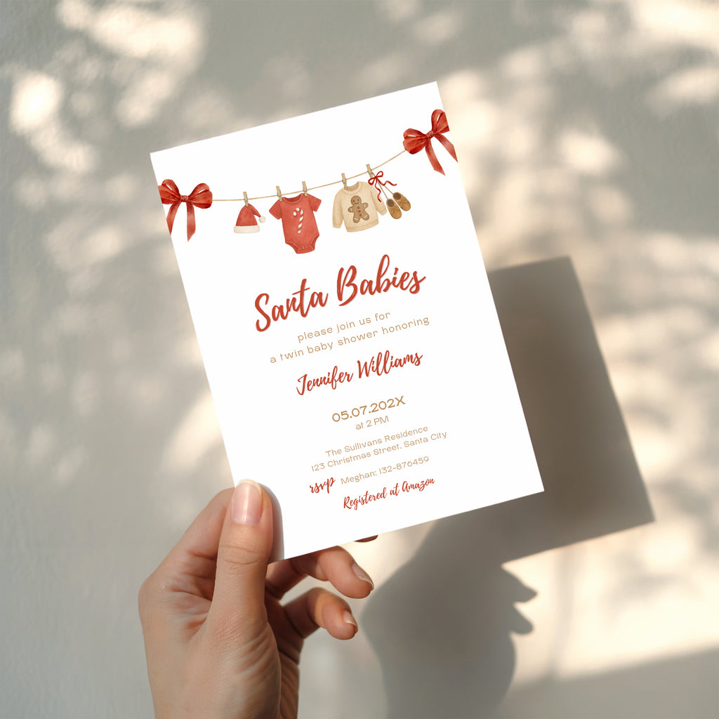 twin santa baby shower invitation with red bows and watercolor baby clothesline illustration