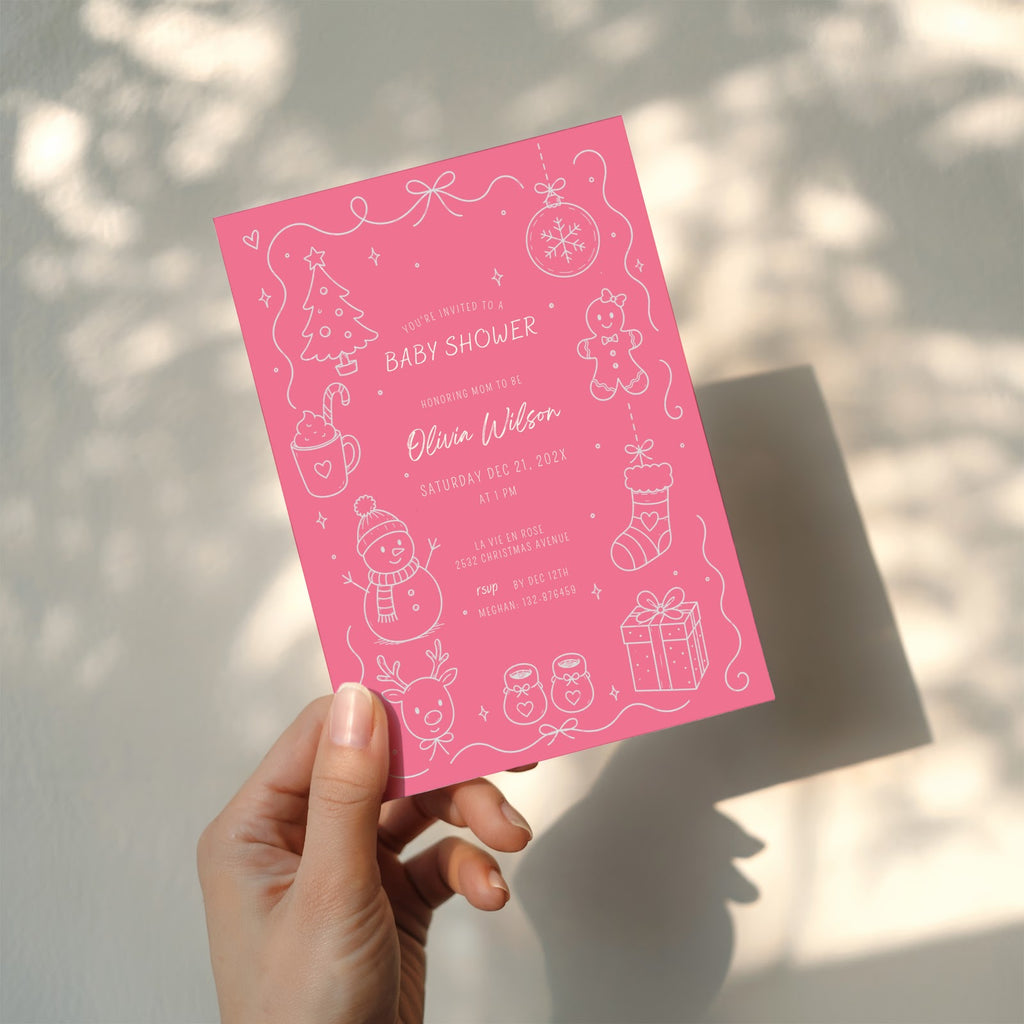 Christmas baby shower invitation with soft pink winter design for a festive celebration