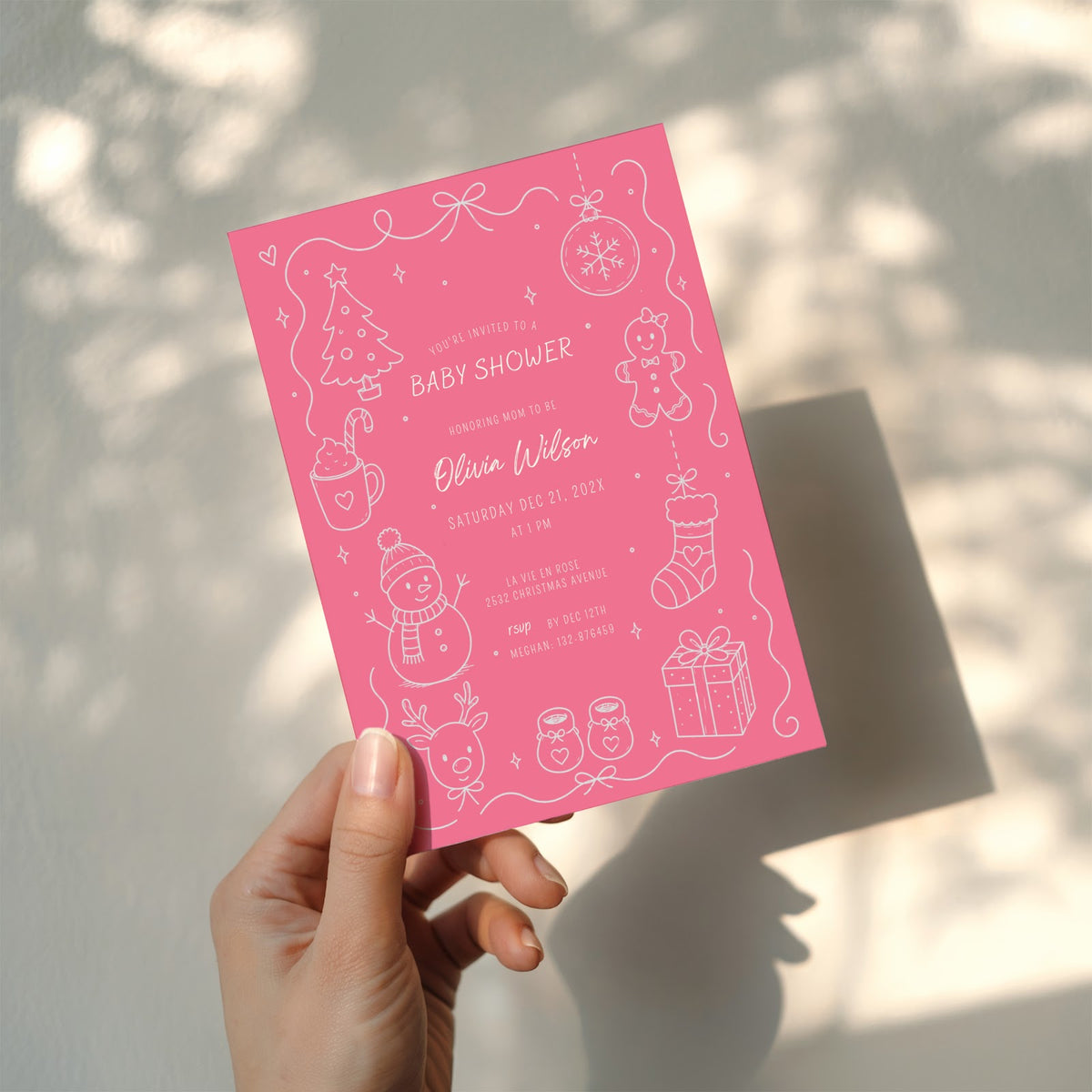 Christmas baby shower invitation with soft pink winter design for a festive celebration