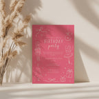Christmas birthday party invitation with pink nutcracker ballerina illustration and white text for a festive winter celebration